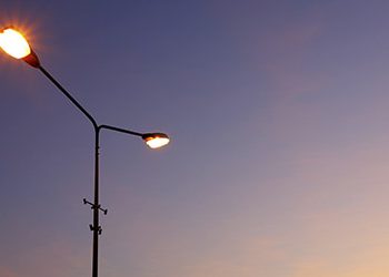 Sky view with street light illuminated in the sunset